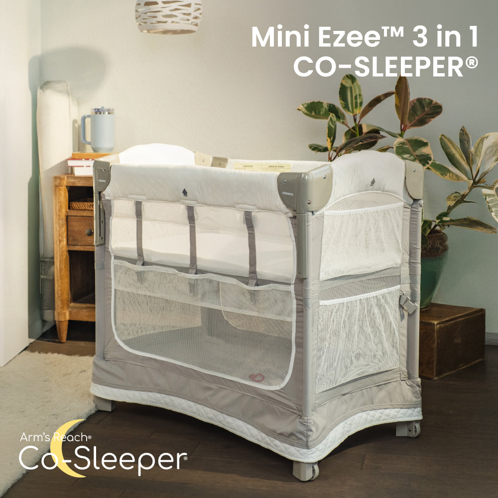 Mini Ezee 3-in-1 Co-Sleeper bassinet attached beside an adult bed