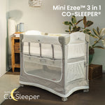 Mini Ezee 3-in-1 Co-Sleeper bassinet attached beside an adult bed