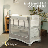 Mini Ezee 3-in-1 Co-Sleeper bassinet attached beside an adult bed